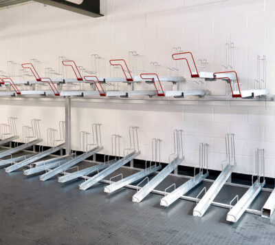 A row of Two Tier Cycle Racks inside of a commercial building