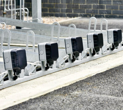 Two Tier E-Bike Racks installed in an out door bike shelter